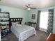 Bedroom with ceiling fan, window, bed, and decor at 3726 W Campo Bello Dr, Glendale, AZ 85308