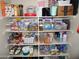 Pantry stocked with a variety of food and household items on multiple shelves at 3726 W Campo Bello Dr, Glendale, AZ 85308