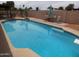 Refreshing in-ground pool with a diving board and poolside seating perfect for relaxation at 3726 W Campo Bello Dr, Glendale, AZ 85308