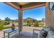 Inviting covered back porch overlooking the well-manicured backyard at 41825 W Mesquite Rd, Maricopa, AZ 85138