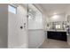 Bright bathroom featuring walk-in shower with frameless glass enclosure and dual shower heads at 41825 W Mesquite Rd, Maricopa, AZ 85138