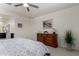 Bedroom features a ceiling fan, a window, and a cozy ambiance at 41825 W Mesquite Rd, Maricopa, AZ 85138