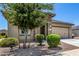 Charming home featuring a well-maintained front yard and a two-car garage at 41825 W Mesquite Rd, Maricopa, AZ 85138