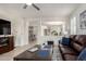 Open-concept living room with stylish furniture and natural light at 41825 W Mesquite Rd, Maricopa, AZ 85138