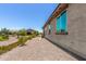 Spacious side yard featuring low-maintenance landscaping at 41825 W Mesquite Rd, Maricopa, AZ 85138