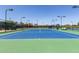 Well-maintained tennis court with professional surfacing and lighting system at 41825 W Mesquite Rd, Maricopa, AZ 85138