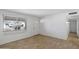 Bright, airy living room with tile flooring, a large window, and a white front door at 4257 E Marino Dr, Phoenix, AZ 85032