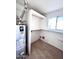 Utility room with shelving and a window, providing practical storage space at 4257 E Marino Dr, Phoenix, AZ 85032