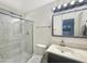 Bathroom features a glass enclosed shower, sink, and vanity at 4533 W Cavalier Dr, Glendale, AZ 85301