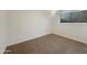 Neutral bedroom with a large window and plush carpet flooring at 4533 W Cavalier Dr, Glendale, AZ 85301