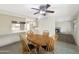 Dining area featuring wooden table and chairs adjacent to the kitchen at 4533 W Cavalier Dr, Glendale, AZ 85301