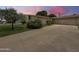 Single story home with a well manicured yard and large driveway at 4533 W Cavalier Dr, Glendale, AZ 85301