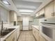 Bright kitchen featuring neutral cabinets, countertops, and appliances at 4533 W Cavalier Dr, Glendale, AZ 85301