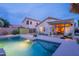 Backyard view showcasing a sparkling pool, covered patio, and lush landscaping for outdoor enjoyment at 490 W Encinas St, Gilbert, AZ 85233