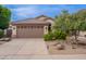 Beautiful single-story home with a tile roof, three-car garage, and desert landscaping at 490 W Encinas St, Gilbert, AZ 85233