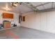 Spacious garage with ample storage cabinets, a utility sink, and an insulated garage door at 490 W Encinas St, Gilbert, AZ 85233