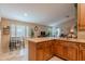 Bright kitchen featuring stainless steel appliances, granite countertops, and a cozy dining area at 490 W Encinas St, Gilbert, AZ 85233