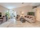 Comfortable living room with neutral colors, ample seating, and a sliding glass door to the patio at 490 W Encinas St, Gilbert, AZ 85233