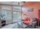 Cozy sunroom with large windows, comfortable seating, and a view of the backyard patio at 490 W Encinas St, Gilbert, AZ 85233