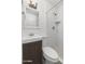 Bright bathroom featuring subway tile walls, hexagon tile floor, and modern fixtures at 5011 S 20Th Pl, Phoenix, AZ 85040