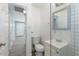 Bathroom featuring subway tile walls, hexagon tile floor, vanity with storage and hallway access at 5011 S 20Th Pl, Phoenix, AZ 85040