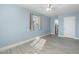 Bedroom featuring blue walls, wood-look tile floor, and natural light from a window at 5011 S 20Th Pl, Phoenix, AZ 85040