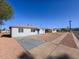 Charming single-story home with a blue door and low maintenance gravel landscaping at 5011 S 20Th Pl, Phoenix, AZ 85040