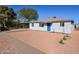 Charming single-story home featuring a vibrant blue front door and desert landscaping for low maintenance curb appeal at 5011 S 20Th Pl, Phoenix, AZ 85040