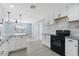This open kitchen offers granite countertops, modern cabinets, and stainless steel appliances at 5011 S 20Th Pl, Phoenix, AZ 85040