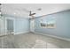 Inviting living room with a large window, ceiling fan, and new floors at 5011 S 20Th Pl, Phoenix, AZ 85040