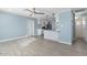 Bright living room showcasing modern gray wood-look tile floors, ceiling fan, and updated light fixtures at 5011 S 20Th Pl, Phoenix, AZ 85040