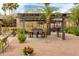Outdoor community seating area with shade, tables, and barbecue grills at 5401 E Van Buren St # 1004, Phoenix, AZ 85008