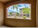 View from a balcony of a multi-story apartment complex with lush landscaping at 5401 E Van Buren St # 1004, Phoenix, AZ 85008