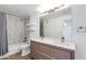 Bathroom featuring a double vanity sink, decorative backsplash, and shower with bathtub at 5401 E Van Buren St # 1004, Phoenix, AZ 85008