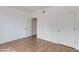 A well-lit bedroom boasts natural wood floors and neutral walls at 5401 E Van Buren St # 1004, Phoenix, AZ 85008