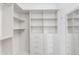 A walk-in closet features custom shelving, hanging racks, and drawer storage at 5401 E Van Buren St # 1004, Phoenix, AZ 85008