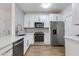 Modern kitchen featuring stainless steel appliances, white cabinets, and subway tile backsplash at 5401 E Van Buren St # 1004, Phoenix, AZ 85008