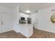 Efficient kitchen layout with stainless steel appliances, white cabinetry, and open to living area at 5401 E Van Buren St # 1004, Phoenix, AZ 85008