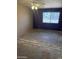 Bright bedroom with a ceiling fan and a large window offering plenty of natural light at 5542 W Monte Cristo Ave, Glendale, AZ 85306