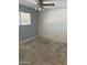 Empty bedroom with a window providing natural light, ready for customization and new flooring at 5542 W Monte Cristo Ave, Glendale, AZ 85306