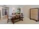 Open dining area features a wooden table with bench and four chairs at 629 E State Ave, Phoenix, AZ 85020