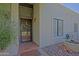 Close up of the front door with a secure iron screen and brick landing at 629 E State Ave, Phoenix, AZ 85020