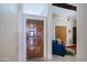 Beautiful wood front door leads to a cozy living area, warm and inviting at 629 E State Ave, Phoenix, AZ 85020