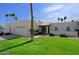 Charming single story home with a lush green lawn and a two car garage at 629 E State Ave, Phoenix, AZ 85020
