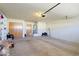 Spacious garage with ample storage shelves, water heater, and functional door system at 629 E State Ave, Phoenix, AZ 85020