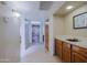 Hallway featuring a front door, tile flooring, and a sink with cabinets at 629 E State Ave, Phoenix, AZ 85020
