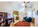 Bright living area with books, a sofa, ceiling fan and kitchen view at 629 E State Ave, Phoenix, AZ 85020