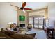 Comfortable living room with fireplace, doors to a patio and natural light at 629 E State Ave, Phoenix, AZ 85020