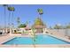 Inviting pool area with lounge chairs, palm trees, and a clear blue swimming pool at 629 E State Ave, Phoenix, AZ 85020