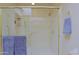 Walk-in shower featuring glass doors and gold hardware, offering a sleek and modern design at 629 E State Ave, Phoenix, AZ 85020